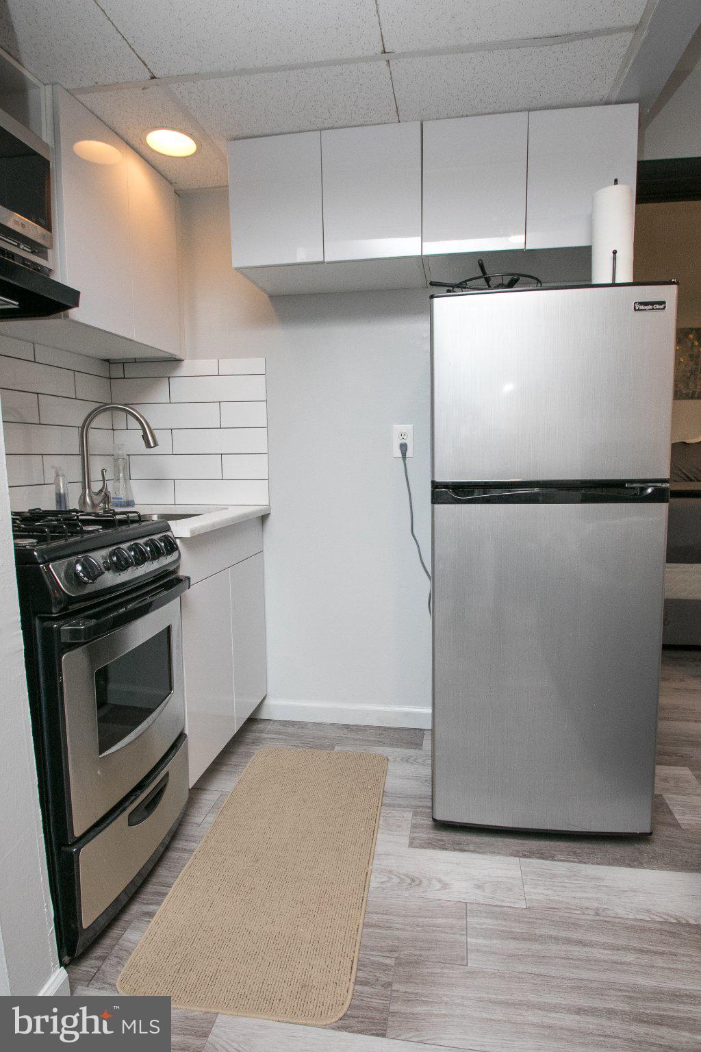 2135 Walnut Street, Unit 304 Philadelphia, PA 19103 - Photo 5 of 8 Modern kitchen with sleek appliances.