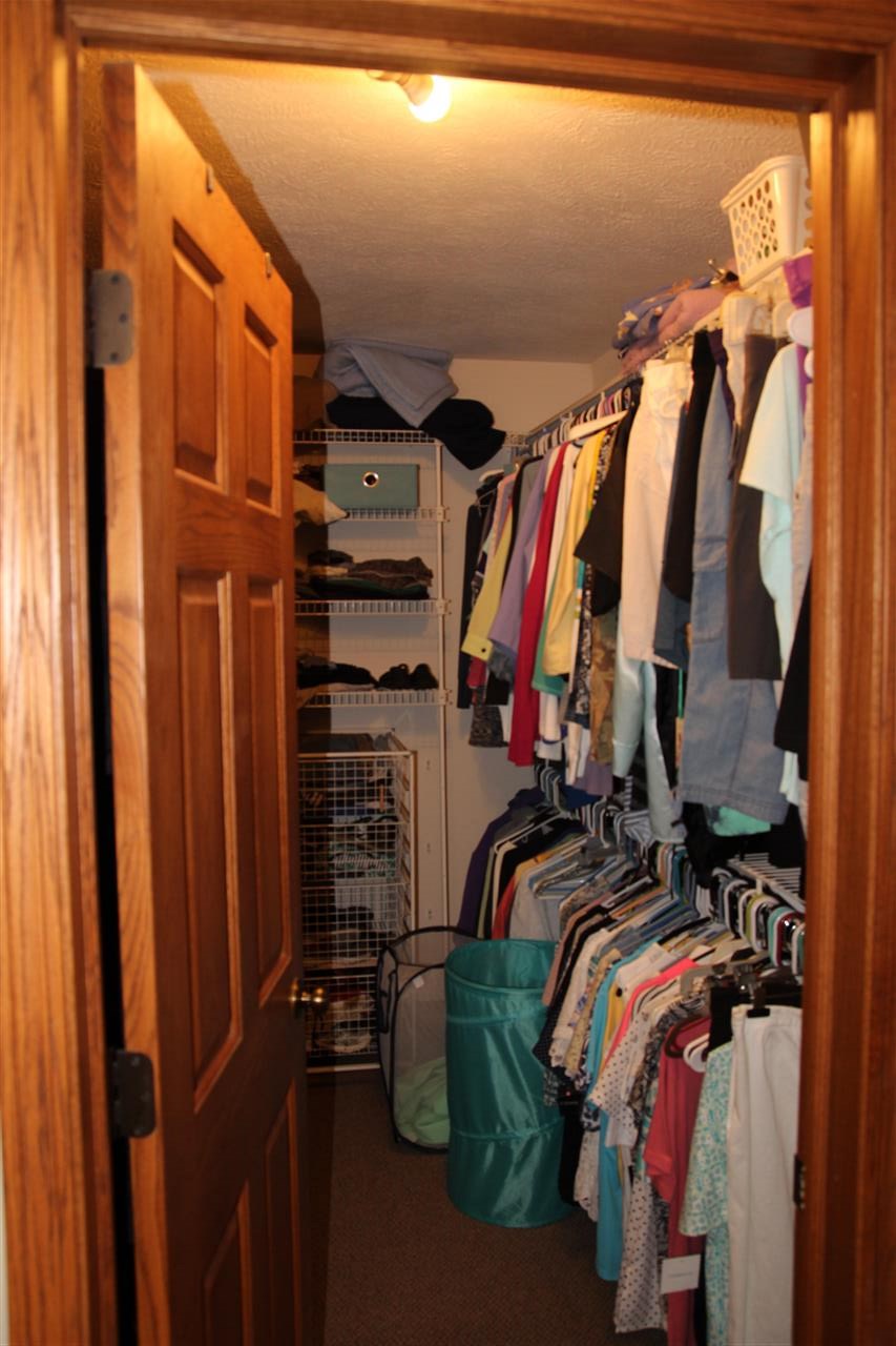 7206 Rye Ridge Trail Cherry Valley, IL 61016 - Photo 13 of 25 a view of walk in closet with clothes and shoes