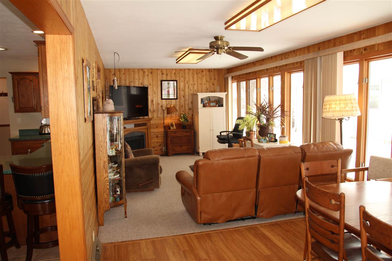 7206 Rye Ridge Trail Cherry Valley, IL 61016 - Photo 8 of 25 a living room with furniture windows and a chandelier