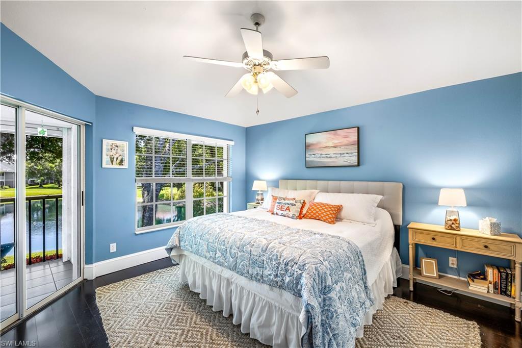1350 Misty Pines Circle, Unit 204 Naples, FL 34105 - Photo 12 of 19 a bedroom with a large bed and a window