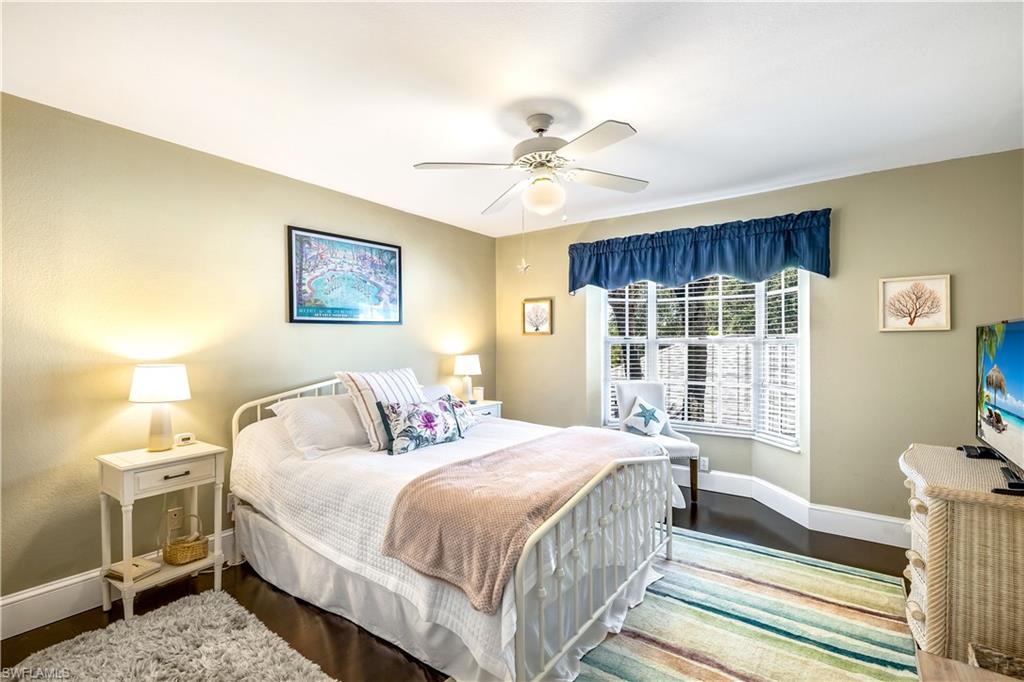 1350 Misty Pines Circle, Unit 204 Naples, FL 34105 - Photo 14 of 19 a bedroom with bed and a window