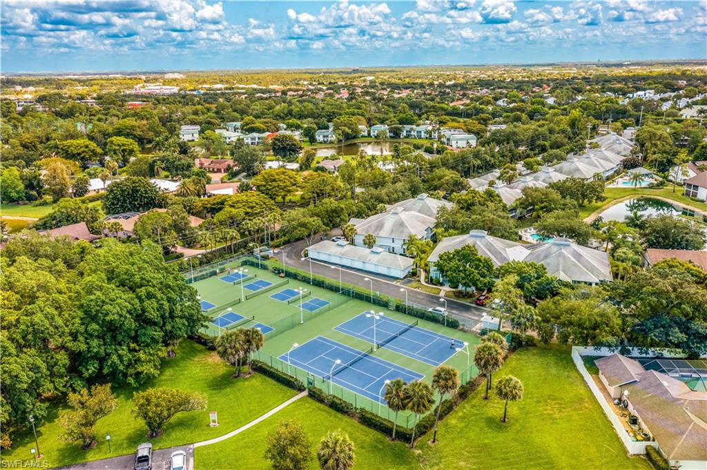 1350 Misty Pines Circle, Unit 204 Naples, FL 34105 - Photo 16 of 19 an aerial view of residential houses with yard