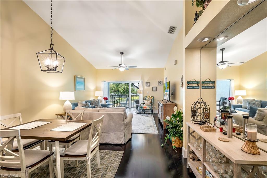 1350 Misty Pines Circle, Unit 204 Naples, FL 34105 - Photo 10 of 19 a view of a dining room with furniture window and outside view
