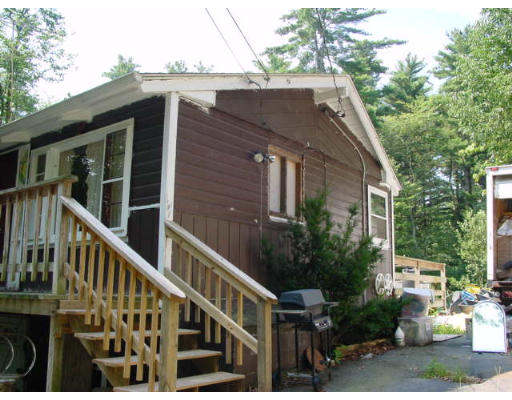 4 Old Mashapaug Road Holland, MA 01521 - Photo 2 of 4 a view of house with outdoor space and sitting area