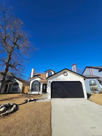 a front view of a house with parking yard