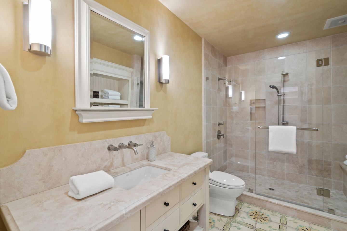 1056 Cascade Drive Menlo Park, CA 94025 - Photo 21 of 32 a bathroom with a granite countertop sink a toilet and shower