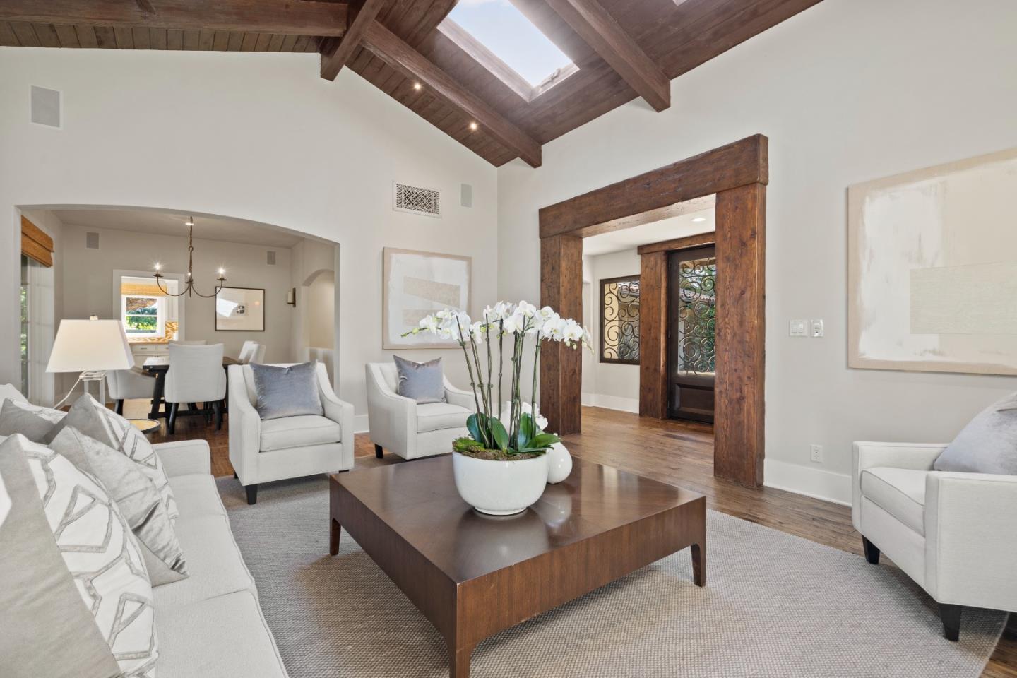 1056 Cascade Drive Menlo Park, CA 94025 - Photo 7 of 32 a living room with furniture a chandelier and a dining table