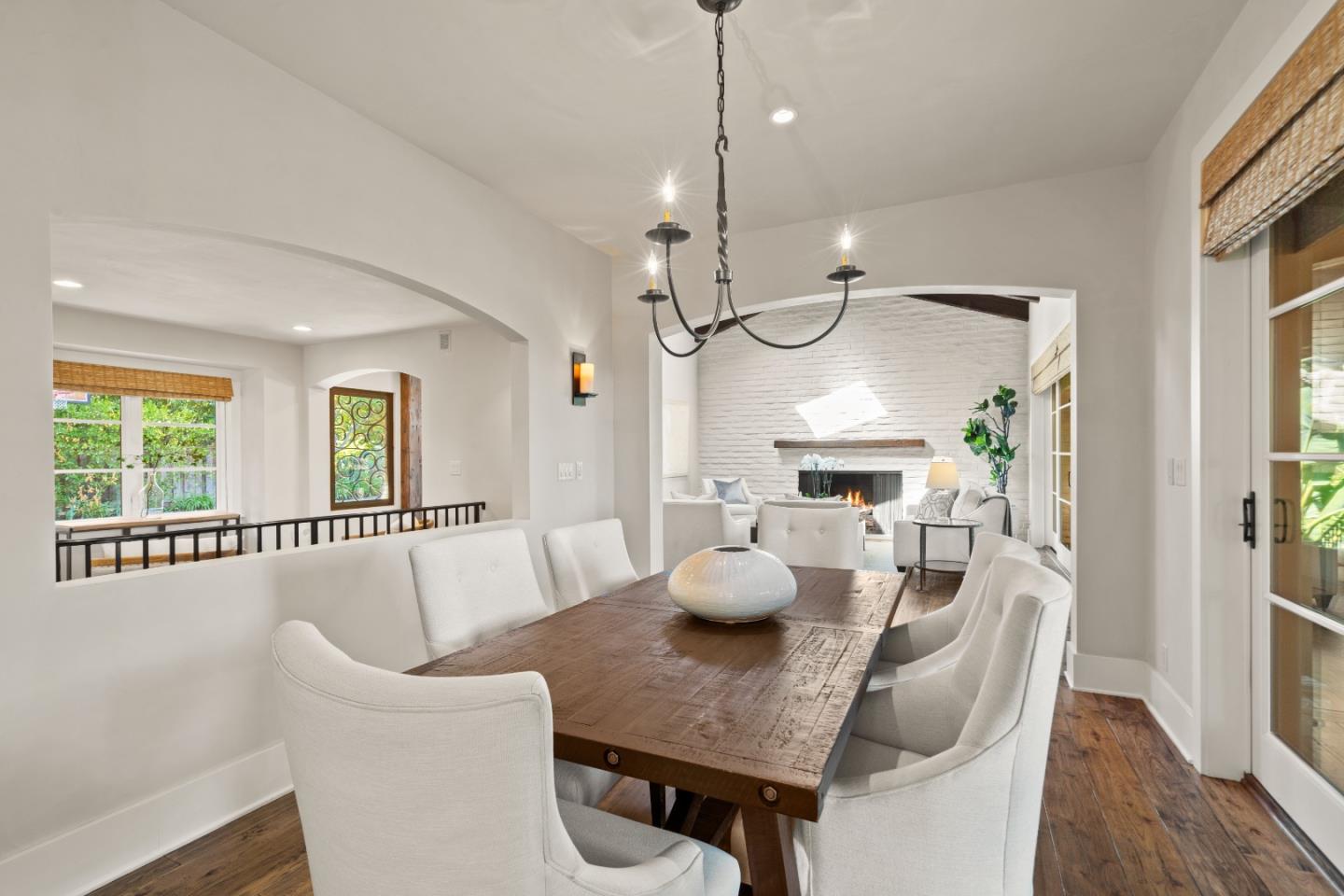 1056 Cascade Drive Menlo Park, CA 94025 - Photo 8 of 32 a view of a dining room with furniture a chandelier and wooden floor