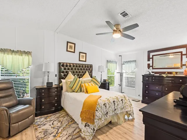 a bedroom with a bed and a couch