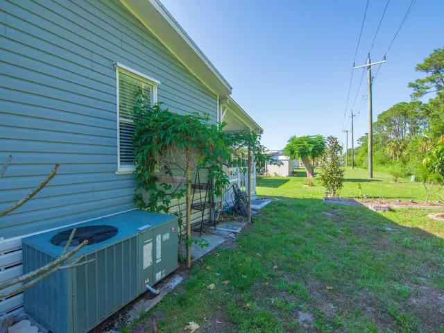 a view of a flower garden in a backyard