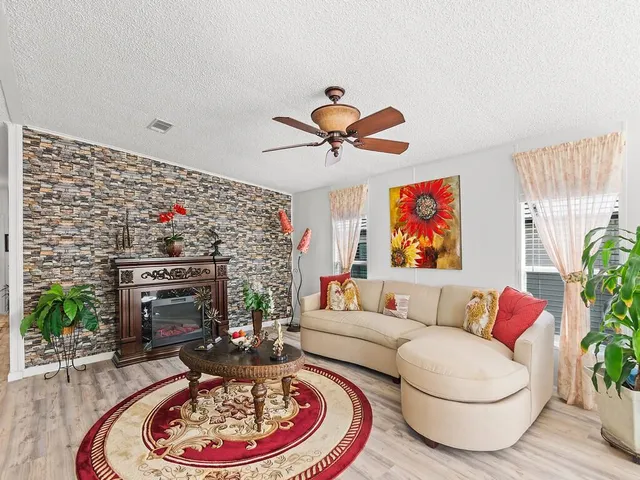 a living room with furniture and a fireplace