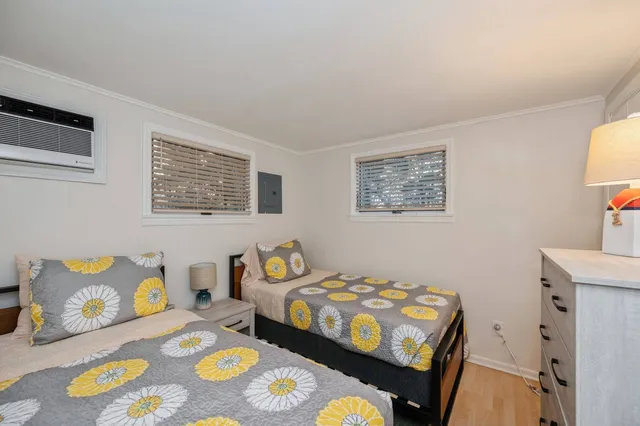 a bedroom with a bed and a table in it