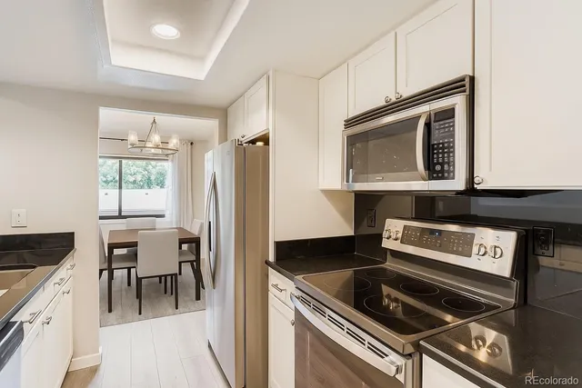 a kitchen with a stove and a microwave