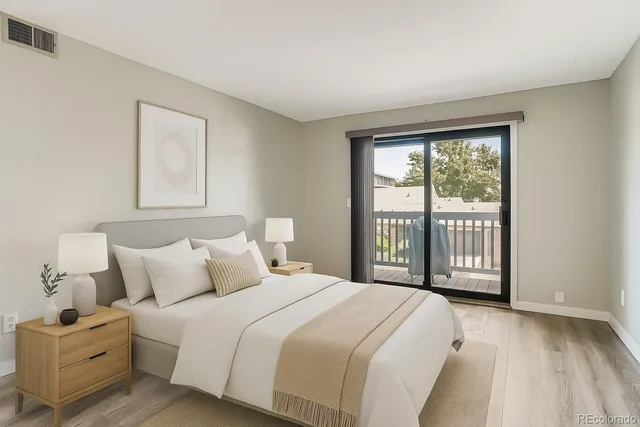 a bedroom with a large bed and a large window