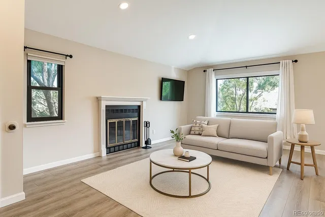 a living room with furniture and a window