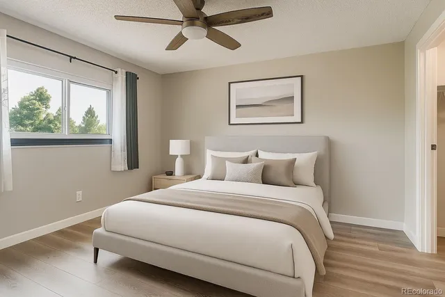 a bedroom with a large bed and a window