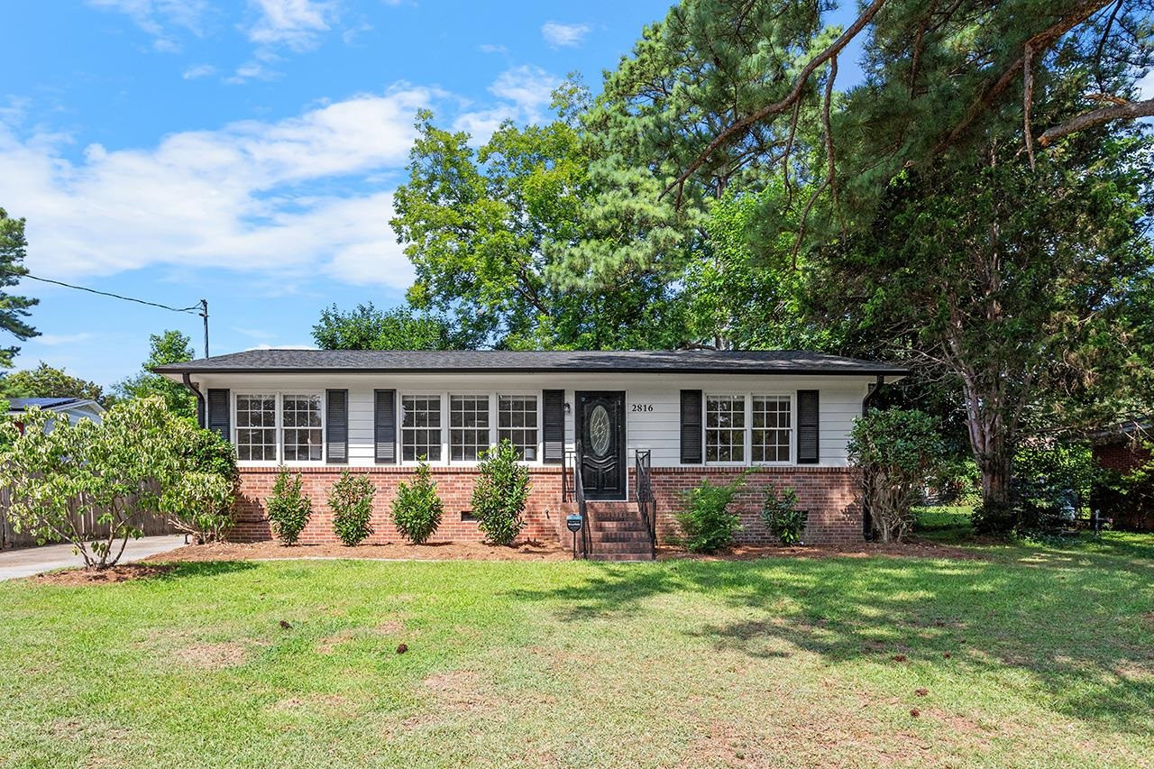 front view of a house with a yard