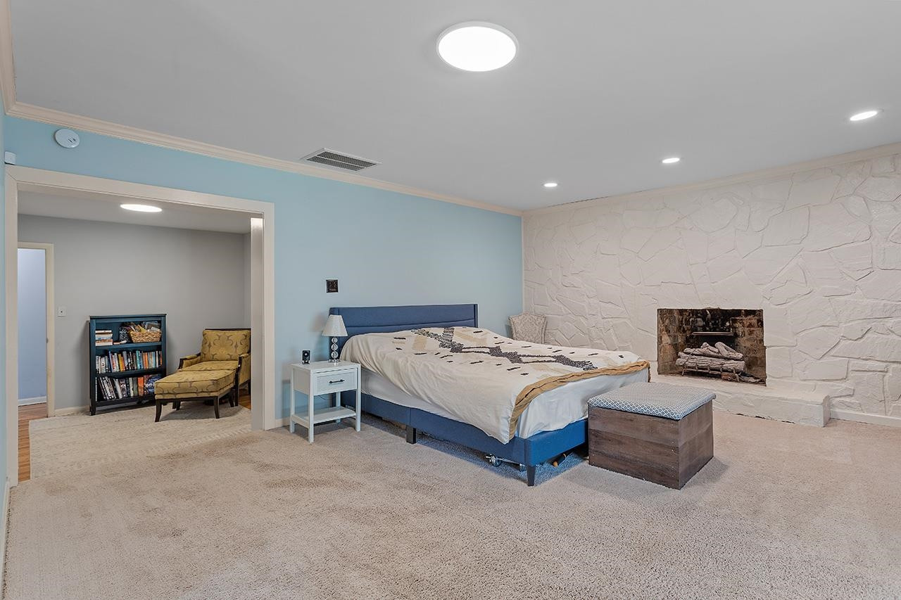 2816 Newark Drive Raleigh, NC 27610 - Photo 18 of 33 a spacious bedroom with a bed and furniture