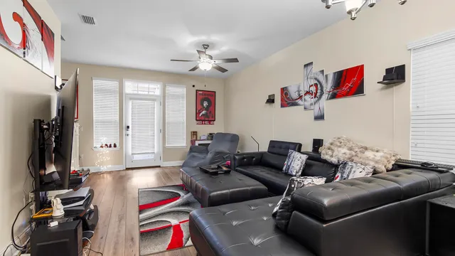 a living room with furniture and a flat screen tv