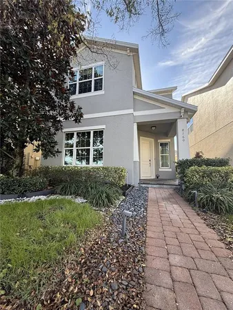 a front view of a house with garden