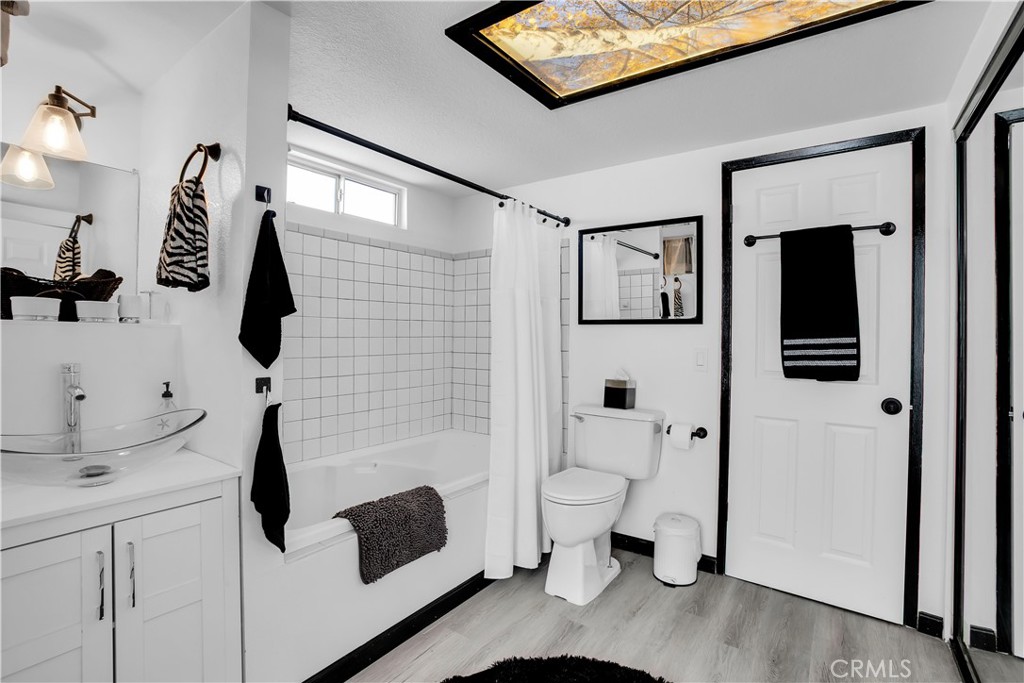 49490 Big Morongo Canyon Road Morongo Valley, CA 92256 - Photo 25 of 75 a bathroom with a toilet sink and mirror