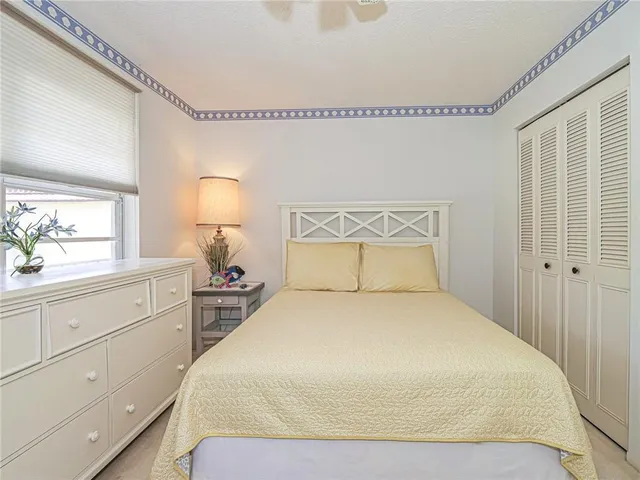 a large white bed in a white room