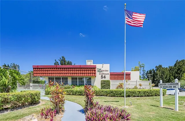 a front view of a building with garden