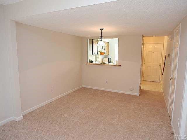2214 Alpine Road Durham, NC 27707 - Photo 3 of 9 The Dining Room has a beautiful oiled bronze light fixture and a convenient pass-through to the kitchen. The washer and dryer, not shown here, come with the home.
