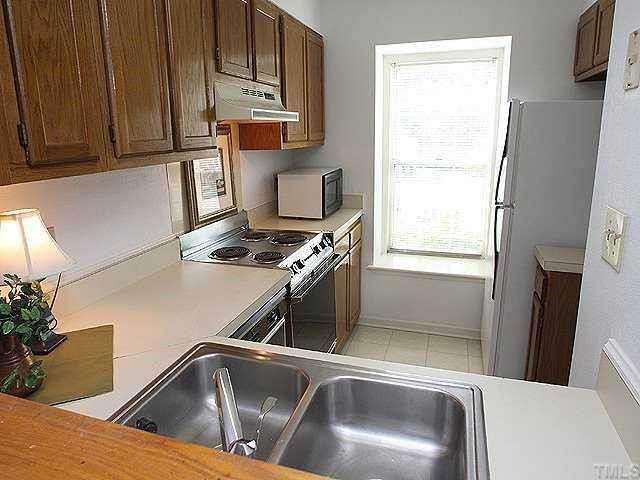 2214 Alpine Road Durham, NC 27707 - Photo 4 of 9 The kitchen has lots of counter space and comes with a refirgerator and microwave. Lots of natural light.