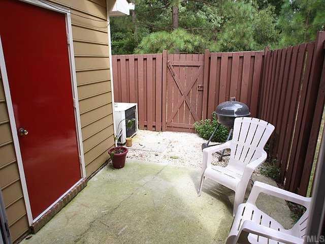 2214 Alpine Road Durham, NC 27707 - Photo 8 of 9 A 10 by 10 concrete patio is surrounded by a 10 by storage shed and added living space for grilling. 2 grills remain with the home.
