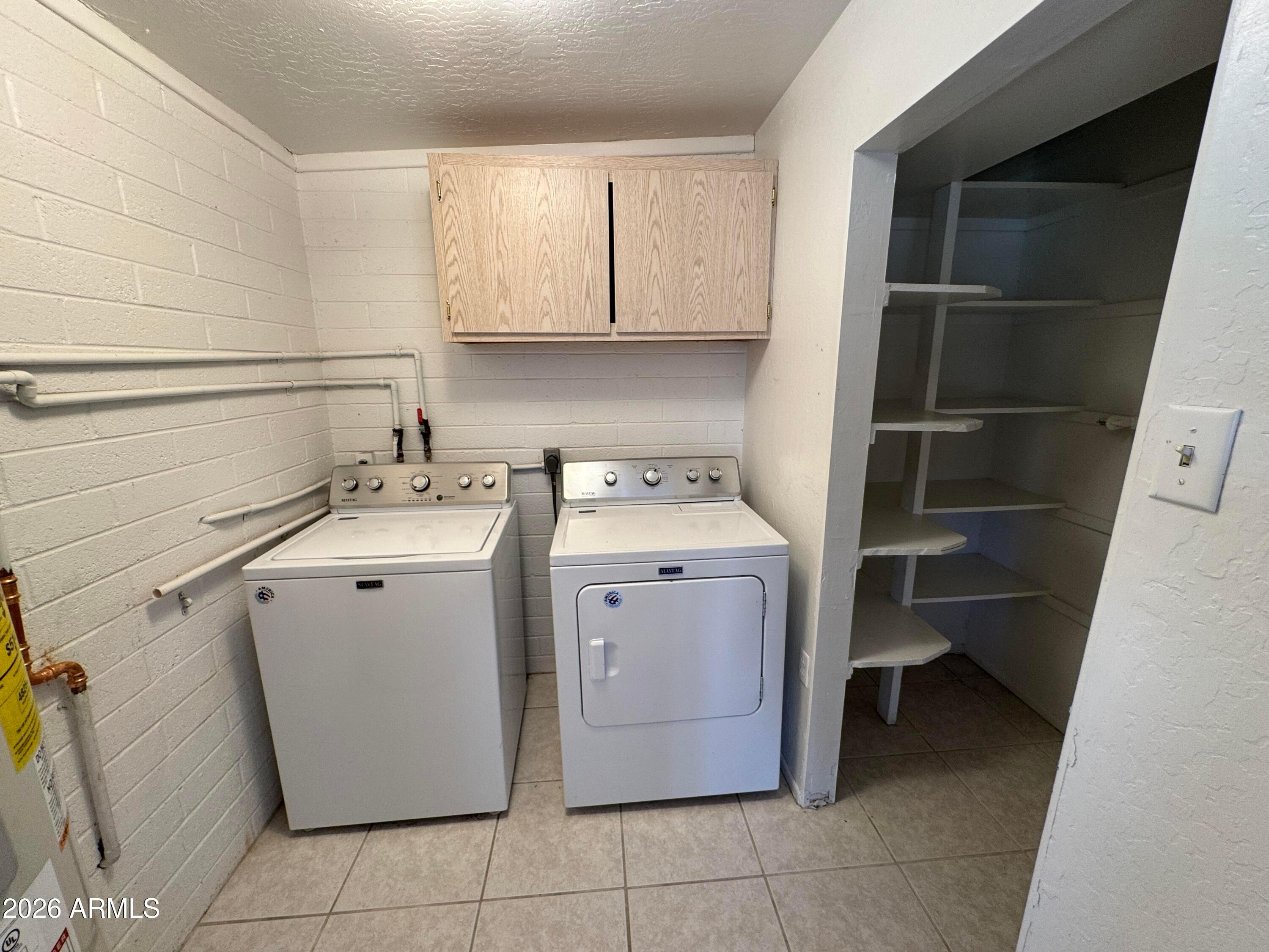 6317 East McLellan Road Mesa, AZ 85205 - Photo 11 of 28 a utility room with a sink washer and dryer