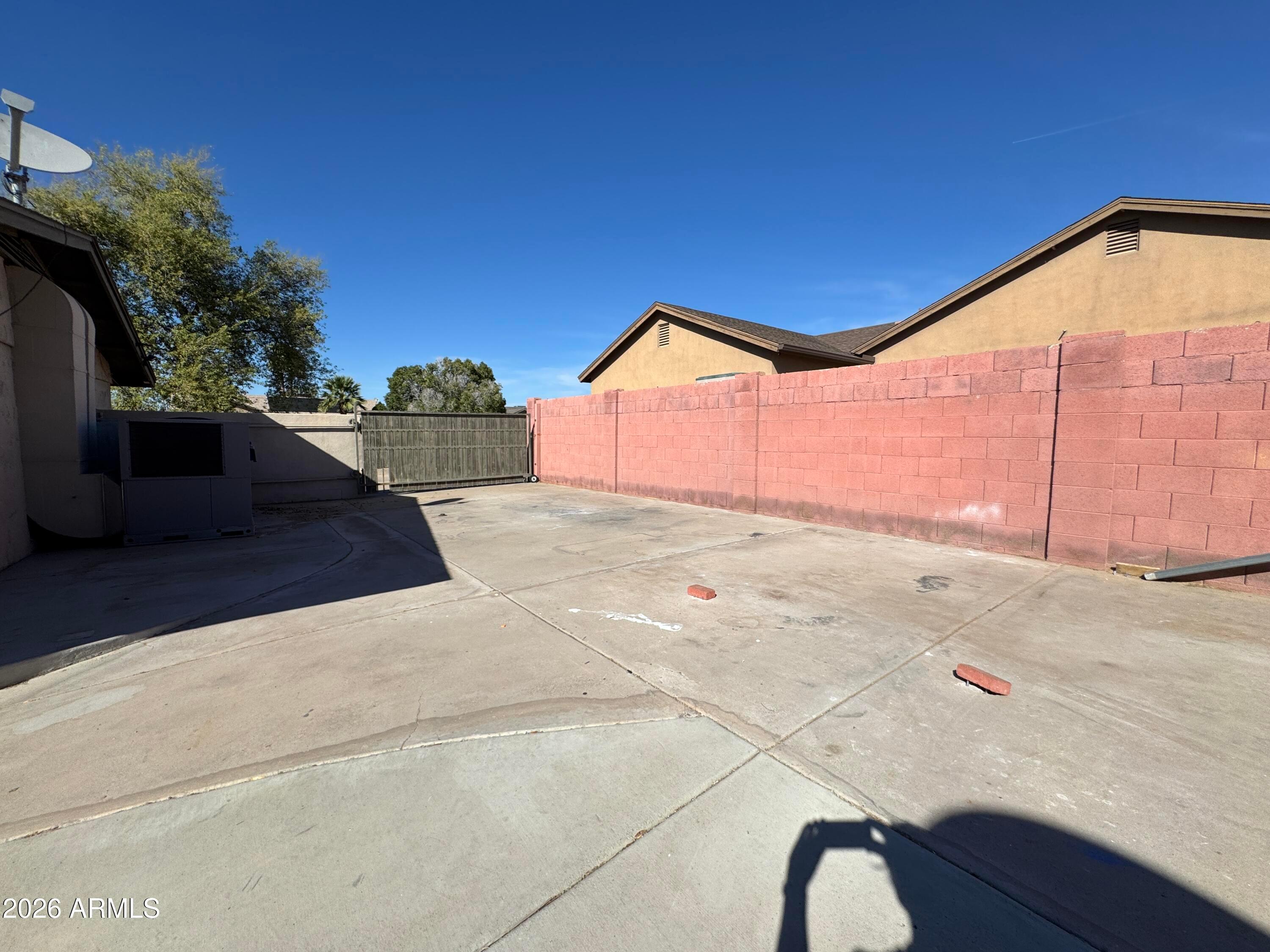 6317 East McLellan Road Mesa, AZ 85205 - Photo 20 of 28 a backyard of a house with seating space