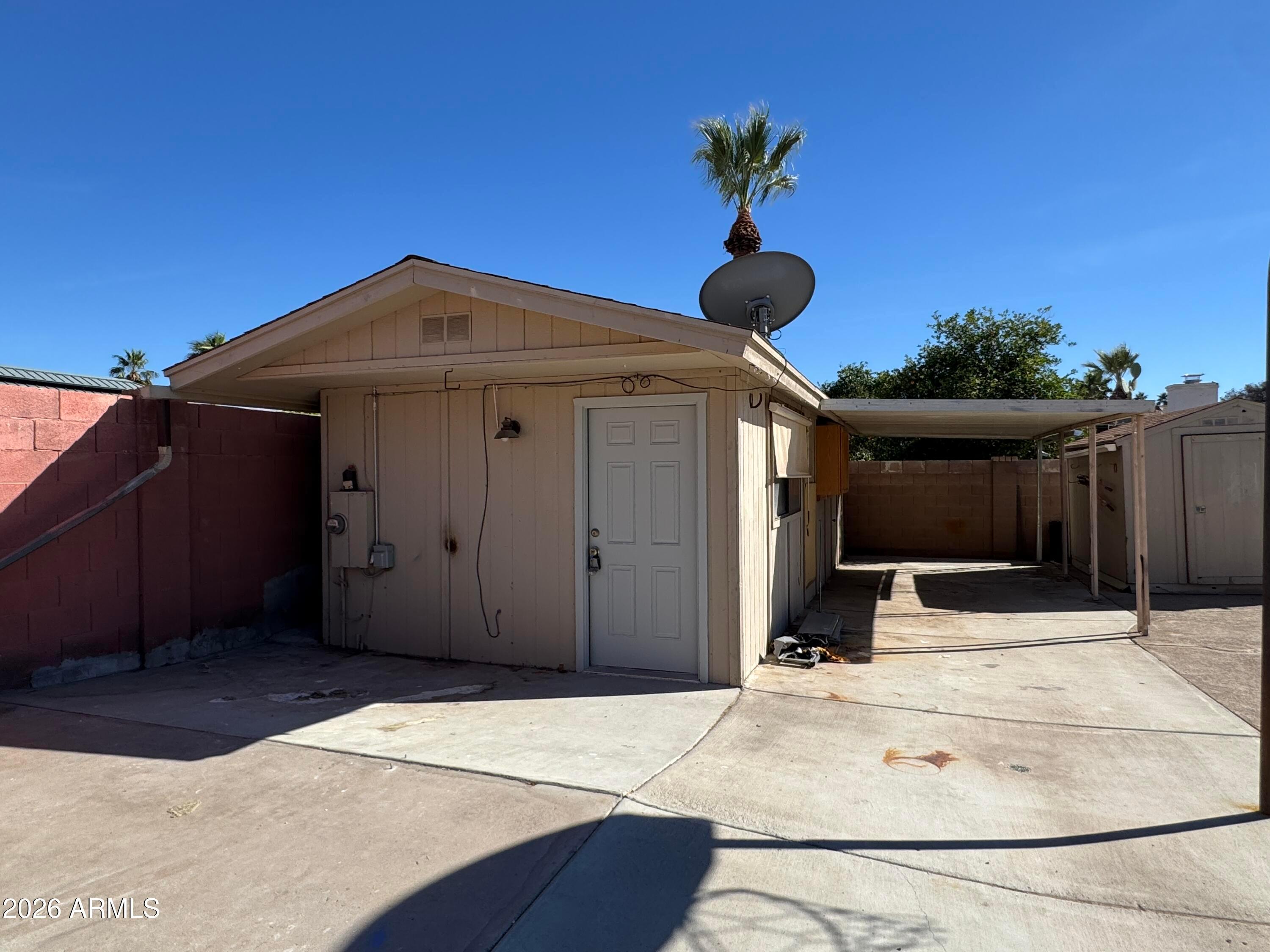 6317 East McLellan Road Mesa, AZ 85205 - Photo 21 of 28 a front view of a house with a yard