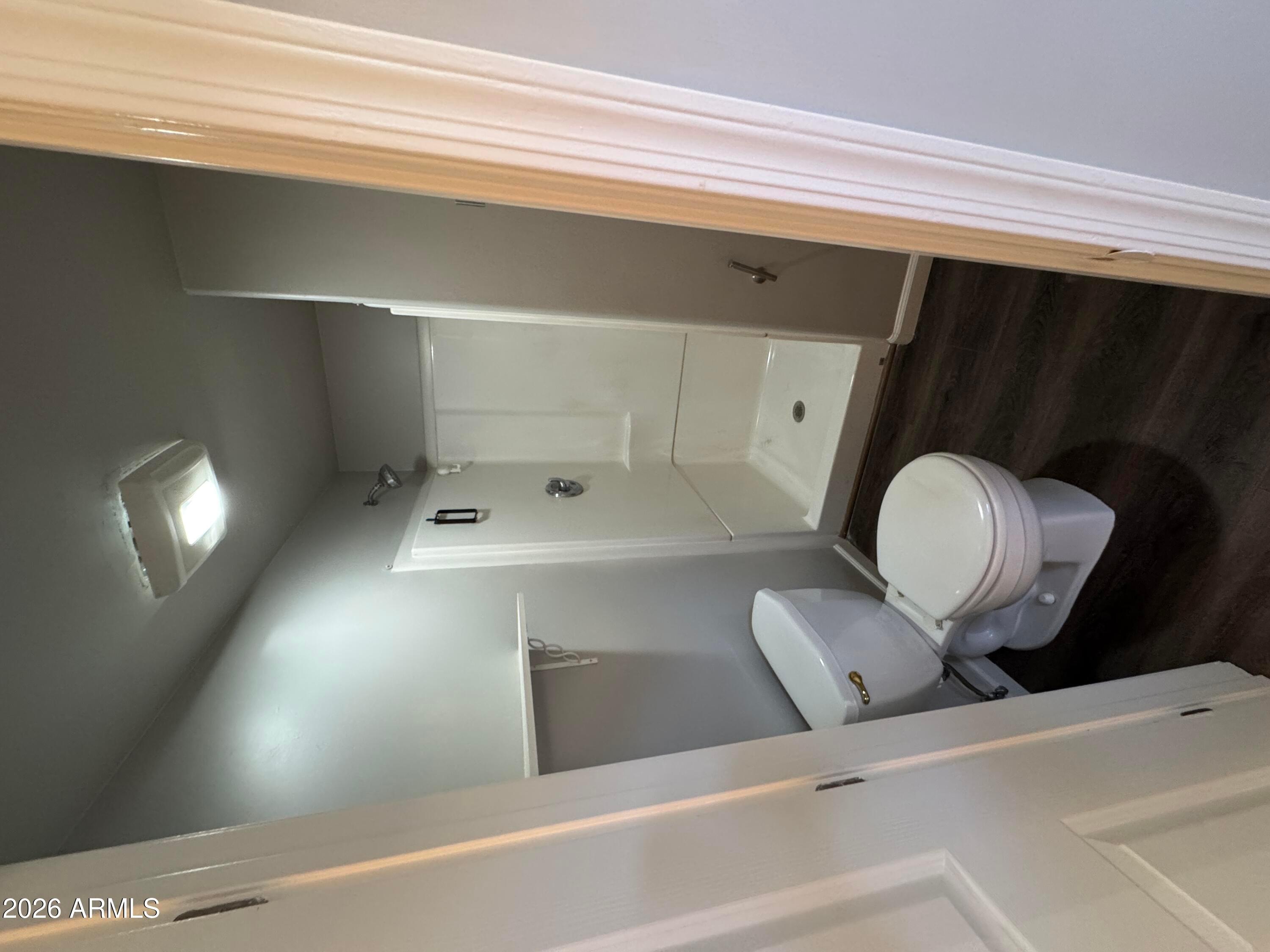 6317 East McLellan Road Mesa, AZ 85205 - Photo 25 of 28 a bathroom with a sink and mirror