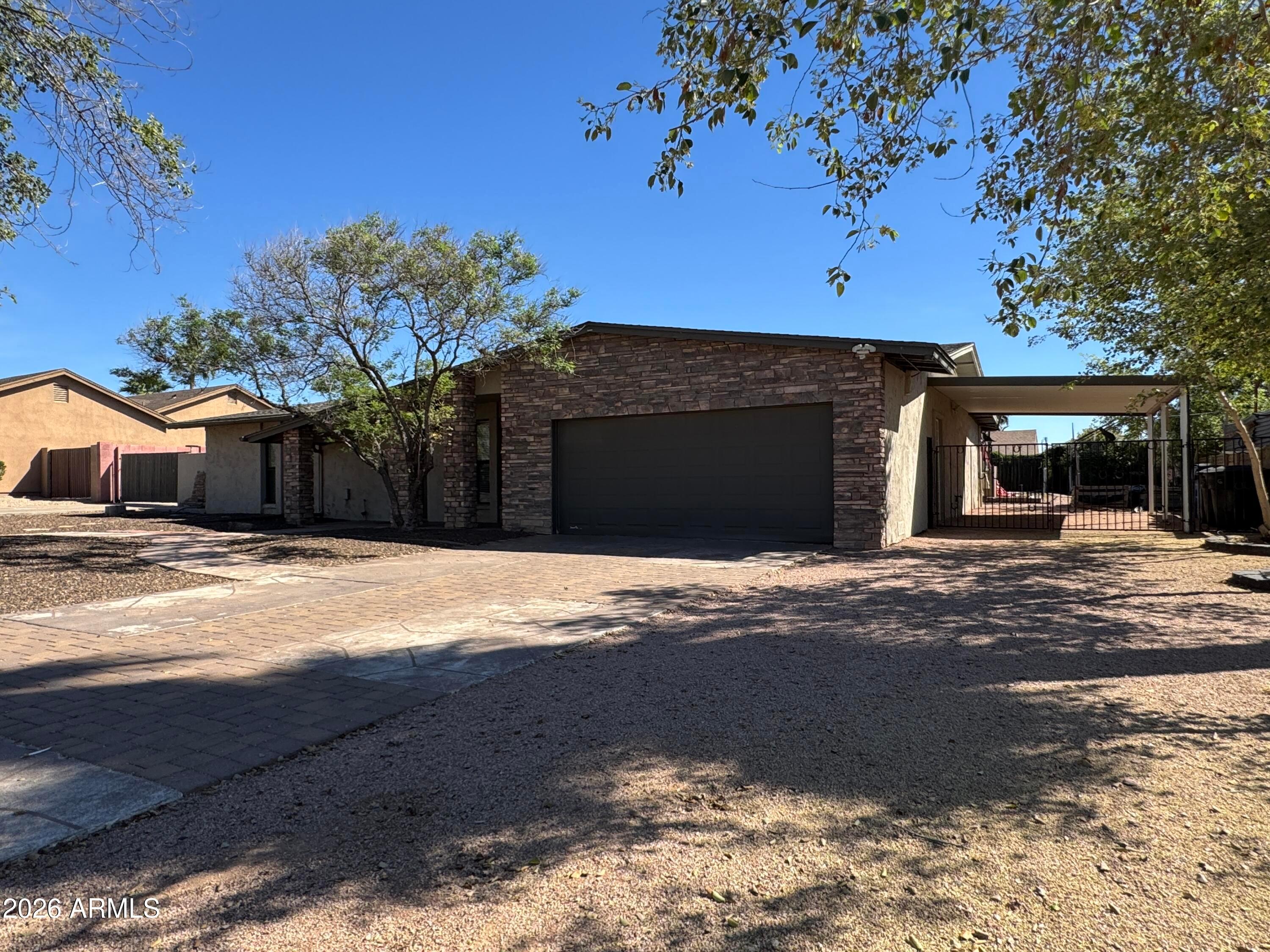 6317 East McLellan Road Mesa, AZ 85205 - Photo 4 of 28 a view of a house with a yard