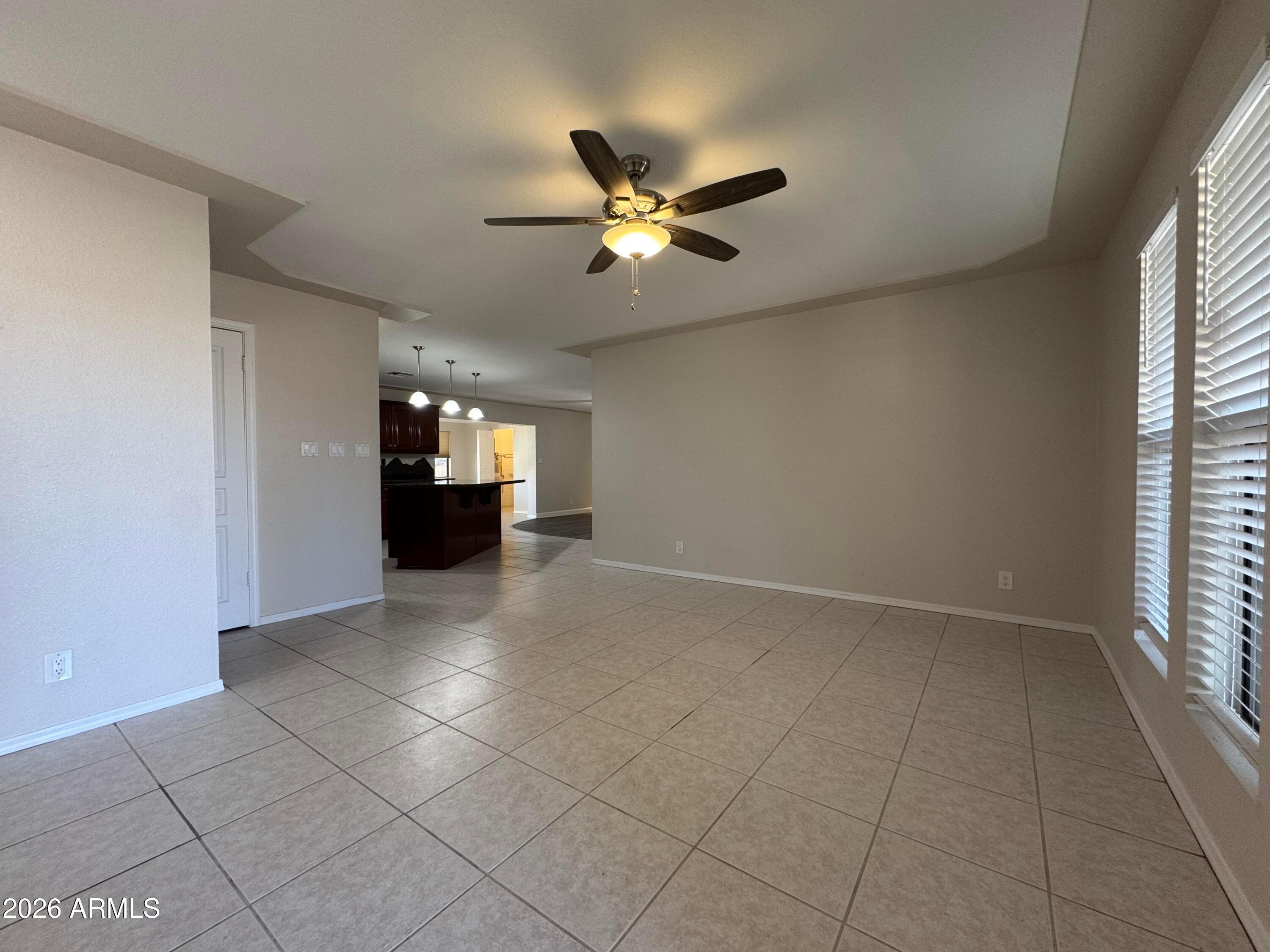 6317 East McLellan Road Mesa, AZ 85205 - Photo 6 of 28 a view of an empty room with a window