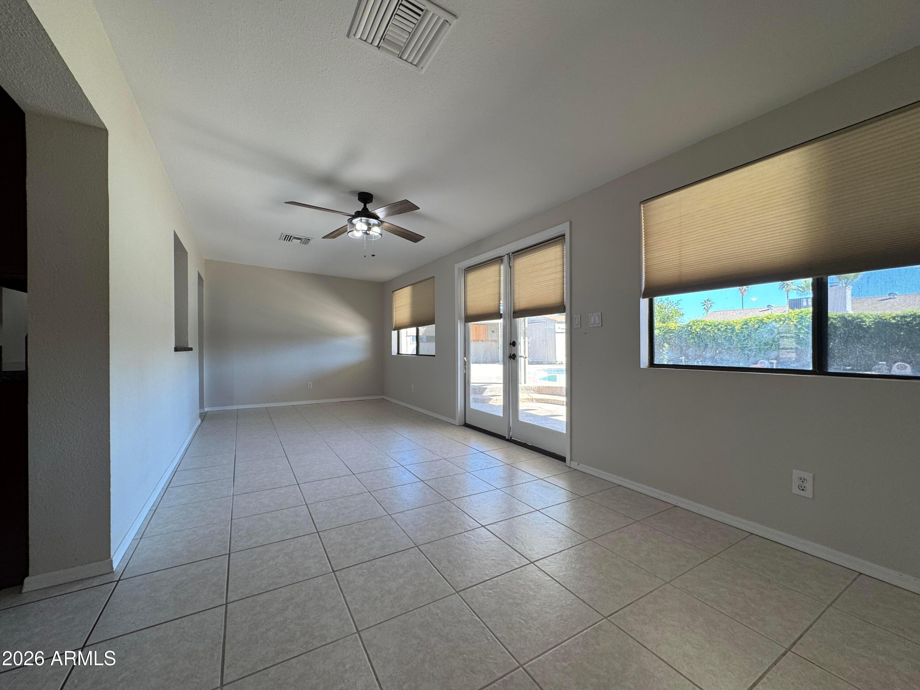 6317 East McLellan Road Mesa, AZ 85205 - Photo 10 of 28 a view of an empty room with a window
