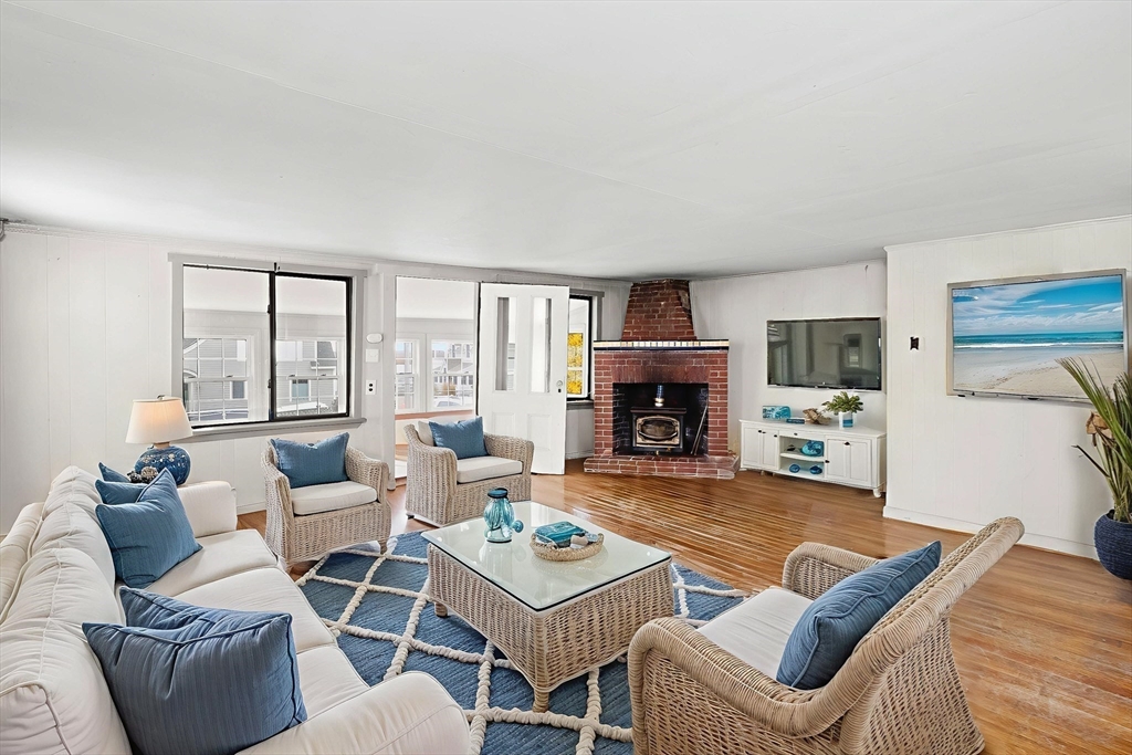 15 Eagle Hill Road Ipswich, MA 01938 - Photo 16 of 41 a living room with furniture fireplace and a large window