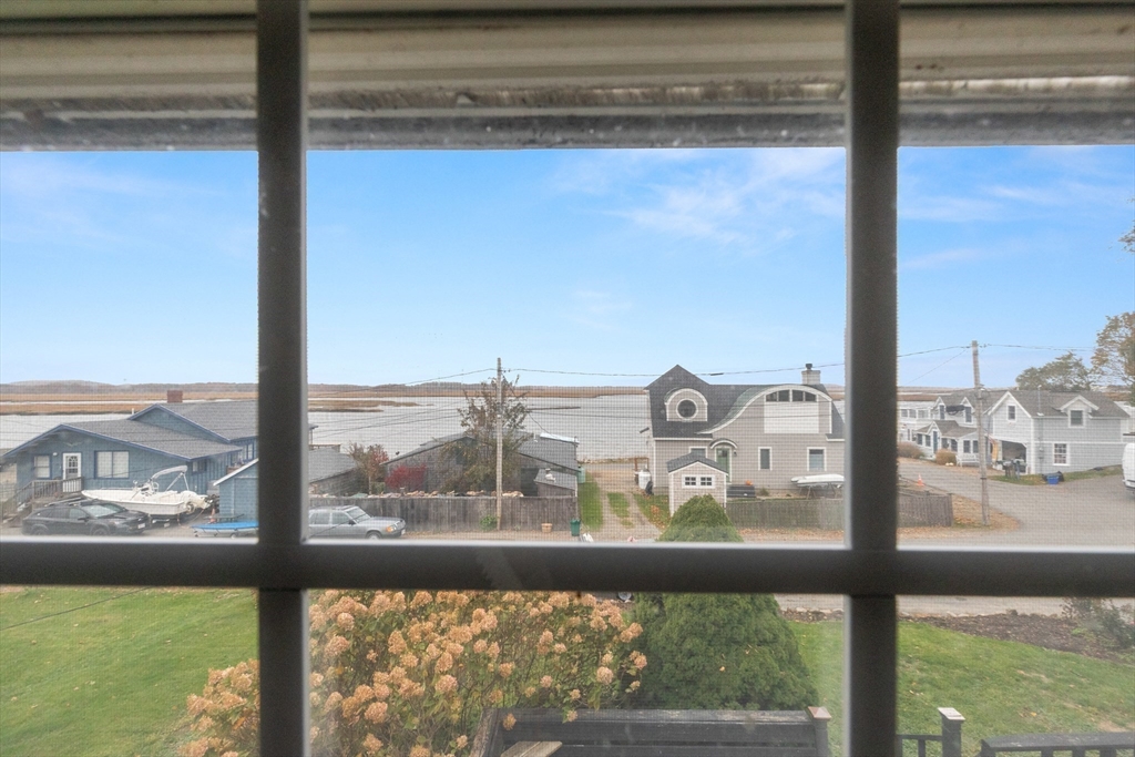 15 Eagle Hill Road Ipswich, MA 01938 - Photo 22 of 41 a view of a glass door with a view of the ocean