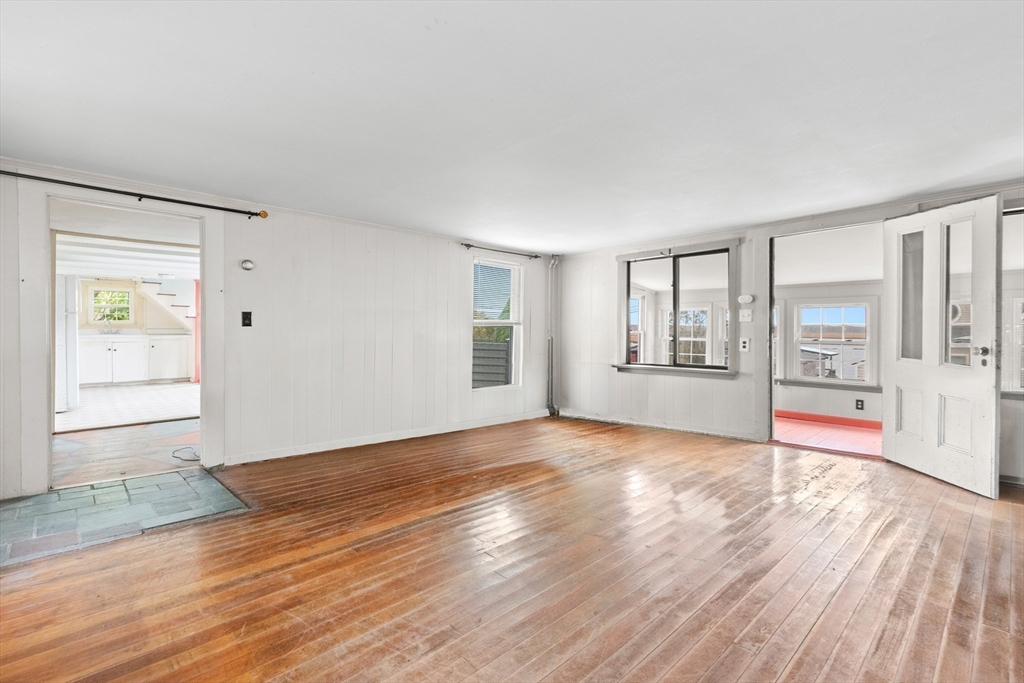 15 Eagle Hill Road Ipswich, MA 01938 - Photo 23 of 41 an empty room with wooden floor and windows