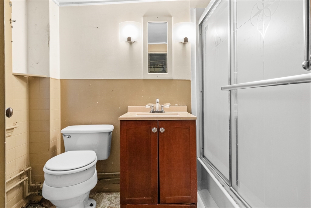 15 Eagle Hill Road Ipswich, MA 01938 - Photo 24 of 41 a bathroom with a toilet a sink and mirror