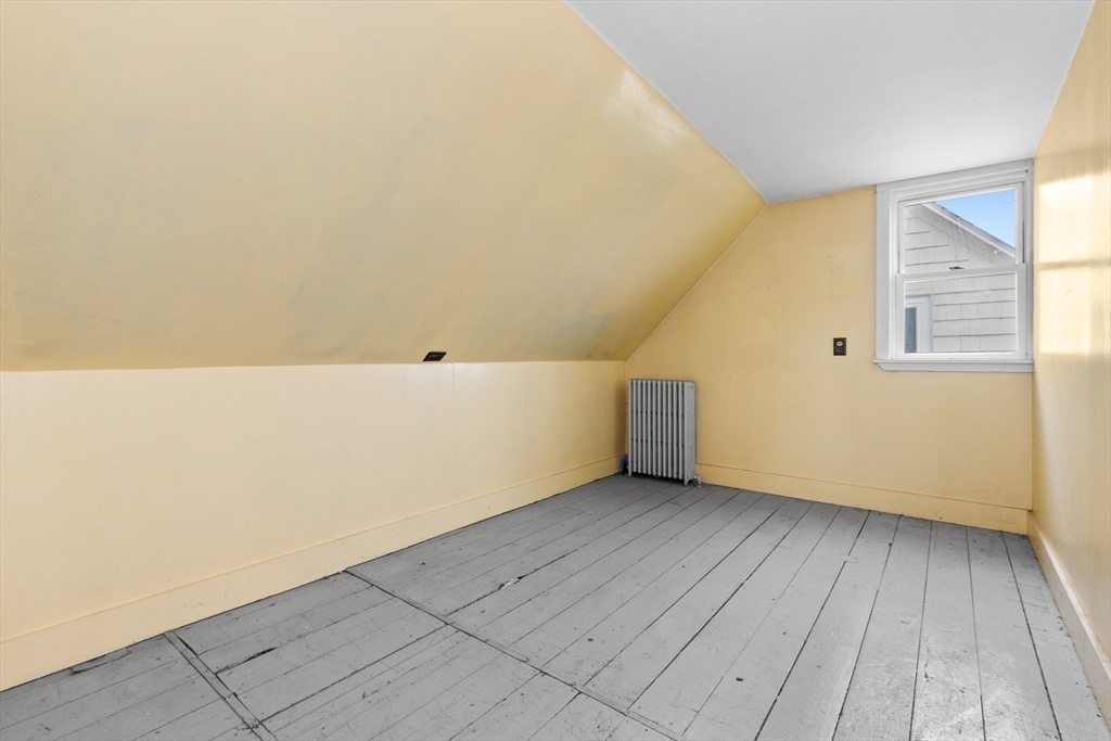 15 Eagle Hill Road Ipswich, MA 01938 - Photo 25 of 41 a view of an empty room with wooden floor and a window