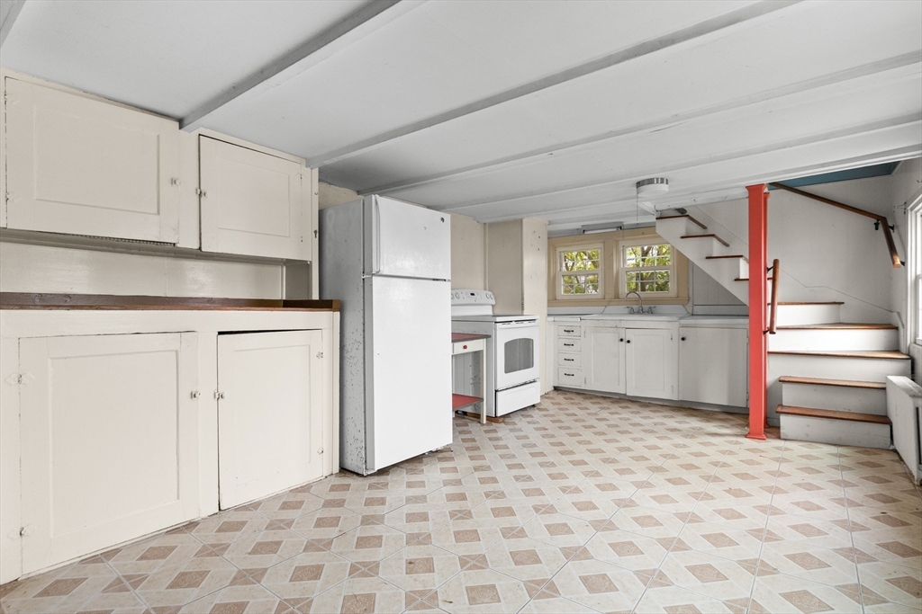 15 Eagle Hill Road Ipswich, MA 01938 - Photo 8 of 41 a kitchen with white cabinets and white appliances