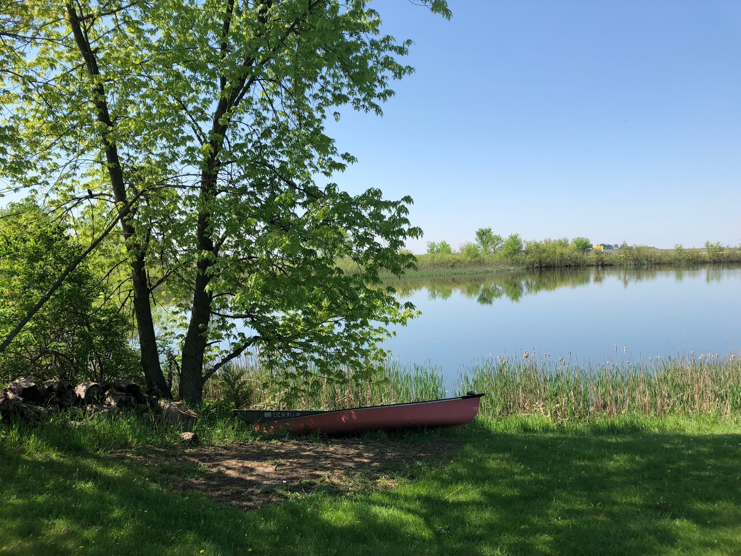 2437 Quarry Road Ashton, IL 61006 - Photo 6 of 13 a view of a lake with a big yard