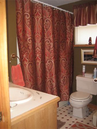 34 Hillandale Road Ashburnham, MA 01430 - Photo 13 of 15 a bathroom with a sink a toilet and a shower curtain