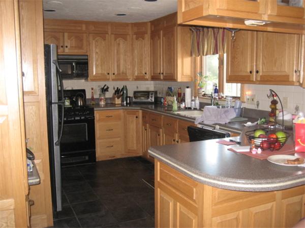34 Hillandale Road Ashburnham, MA 01430 - Photo 2 of 15 a kitchen with stainless steel appliances granite countertop a sink a stove and cabinets