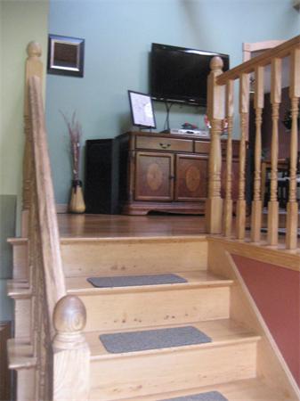 34 Hillandale Road Ashburnham, MA 01430 - Photo 9 of 15 a living room with wooden floor and a flat screen tv