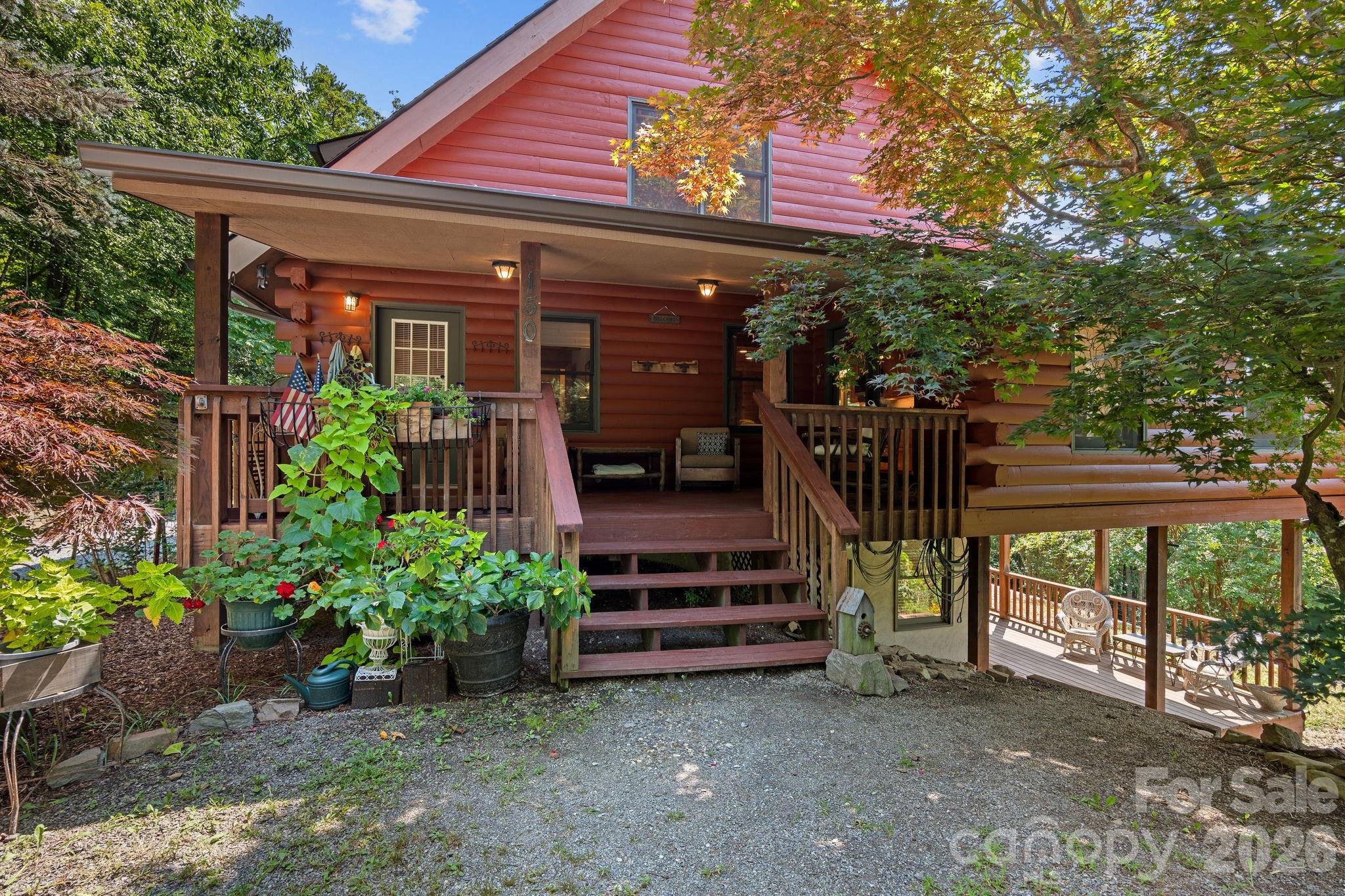 150 Avondale Ridge Road Asheville, NC 28803 - Photo 3 of 45 a view of a house with a porch
