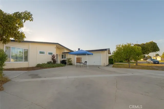 a view of a house with a street and a garage