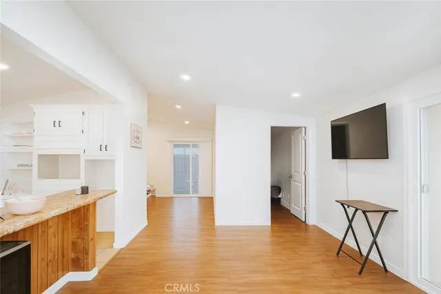 a view of a living room a flat screen tv and kitchen view